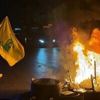 Hezbollah supporters block the old airport road in the southern suburbs of Beirut, with burning tires to protest against the trilateral agreement that was signed between the US, Israel and Lebanon on June 27, 2026. (Ibrahim AMRO / AFP)