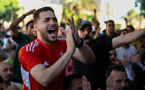 Egyptian football fans react as they watch their national team's 2026 World Cup Group G football match against Iran, at an outdoor cafe in the Sharabiya district of Cairo on June 27, 2026. (Photo by Khaled Desouki/AFP)