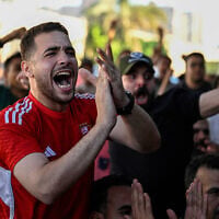 Egyptian football fans react as they watch their national team's 2026 World Cup Group G football match against Iran, at an outdoor cafe in the Sharabiya district of Cairo on June 27, 2026. (Photo by Khaled Desouki/AFP)