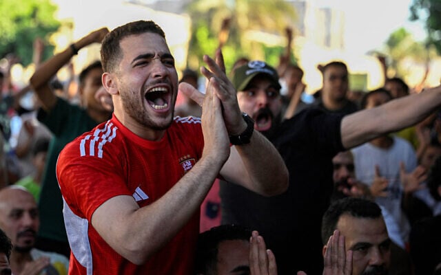 Egyptian football fans react as they watch their national team's 2026 World Cup Group G football match against Iran, at an outdoor cafe in the Sharabiya district of Cairo on June 27, 2026. (Photo by Khaled Desouki/AFP) Egyptian football fans react as they watch their national team's 2026 World Cup Group G football match against Iran, at an outdoor cafe in the Sharabiya district of Cairo on June 27, 2026. (Photo by Khaled Desouki/AFP)