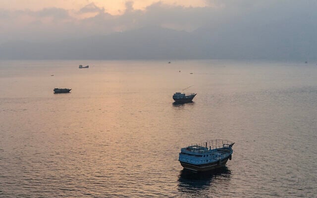 This aerial photograph shows boats anchored off Oman's northern Musandam Peninsula near the Strait of Hormuz on June 27, 2026. (AFP)