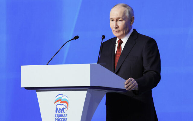 In this pool photograph distributed by Russian state agency Sputnik, Russia's Vladimir Putin addresses the audience at the 23rd Congress of the United Russia party in Moscow on June 28, 2026. (Yekaterina Shtukina/Pool/AFP)