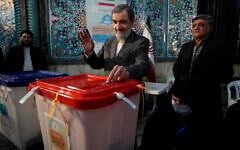 Former Revolutionary Guard commander Mohsen Rezaei casts his ballot during the parliamentary and Assembly of Experts elections at a polling station in Tehran, Iran, March 1, 2024. (AP/Vahid Salemi)