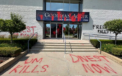 Anti-Israel graffiti at the outside of the Goodman Acker law offices, Monday, June 3, 2024, in Southfield, Michigan, part of an alleged campaign targeting businesses connected to the University of Michigan. (AP Photo/Corey Williams)