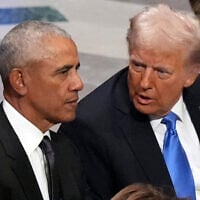 Former US President Barack Obama talks with then-President-elect Donald Trump before the state funeral for former US President Jimmy Carter at Washington National Cathedral in Washington, on January 9, 2025. (AP Photo/Jacquelyn Martin)