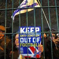 People demonstrate ahead of the Europa League soccer match between Aston Villa and Maccabi Tel Aviv in Birmingham, England, November 6, 2025. (AP Photo/Darren Staples)