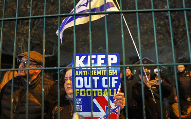 People demonstrate ahead of the Europa League soccer match between Aston Villa and Maccabi Tel Aviv in Birmingham, England, November 6, 2025. (AP Photo/Darren Staples)