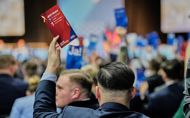 A delegate casts his vote during the re-founding of the AfD youth organization in Giessen, Germany, November 29, 2025. (AP Photo/Martin Meissner) A delegate casts his vote during the re-founding of the AfD youth organization in Giessen, Germany, November 29, 2025. (AP Photo/Martin Meissner)