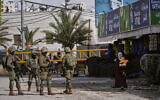 Illustrative: Israeli soldiers take up positions during an army raid in the West Bank city of Hebron on January 19, 2026. (AP Photo/Mahmoud Illean)