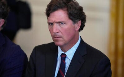 Tucker Carlson attends a meeting with US President Donald Trump and oil executives in the East Room of the White House, January 9, 2026, in Washington. (AP Photo/Alex Brandon) Tucker Carlson attends a meeting with US President Donald Trump and oil executives in the East Room of the White House, January 9, 2026, in Washington. (AP Photo/Alex Brandon)