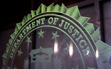 Illustrative: A sign reading Department of Justice is displayed at the FBI field office, in Portland, Oregon. January 16, 2025. (AP Photo/Jenny Kane, File)
