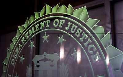 Illustrative: A sign reading Department of Justice is displayed at the FBI field office, in Portland, Oregon. January 16, 2025. (AP Photo/Jenny Kane, File)