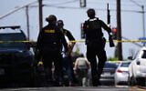 Police at the scene of a shooting outside the Islamic Center of San Diego, in San Diego, California, May 18, 2026. (AP Photo/Gregory Bull)