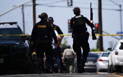 Police at the scene of a shooting outside the Islamic Center of San Diego, in San Diego, California, May 18, 2026. (AP Photo/Gregory Bull)
