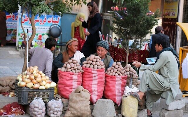 Vendors sell potatoes at their stall in a street market in Kabul, Afghanistan, May 14, 2026. (AP Photo/Siddiqullah Alizai)