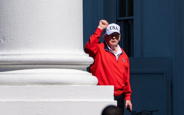 US President Donald Trump pumps his fist as he arrives at the White House, Sunday, May 31, 2026, in Washington. (AP Photo/Alex Brandon)