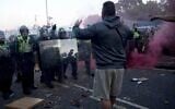 In this image taken from PA Video, police and protestors clash during a protest following the death of Henry Nowak, a 18-year-old student stabbed to death with a Sikh kirpan ceremonial dagger by Vickrum Digwa, in Southampton, England, June 2, 2026. (Jamie Lashmar/PA via AP)