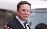 Elon Musk departs after a welcome ceremony with President Donald Trump and China's President Xi Jinping at the Great Hall of the People, Thursday, May 14, 2026, in Beijing. (AP Photo/Mark Schiefelbein, File)