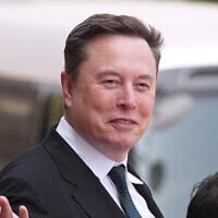 Elon Musk departs after a welcome ceremony with President Donald Trump and China's President Xi Jinping at the Great Hall of the People, Thursday, May 14, 2026, in Beijing. (AP Photo/Mark Schiefelbein, File)