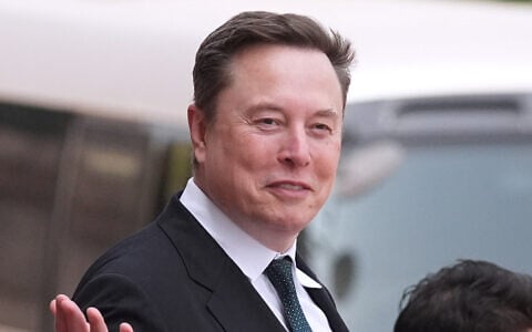 Elon Musk departs after a welcome ceremony with President Donald Trump and China's President Xi Jinping at the Great Hall of the People, Thursday, May 14, 2026, in Beijing. (AP Photo/Mark Schiefelbein, File)