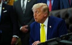 US President Donald Trump listens at an event about coal, on June 4, 2026, in the Oval Office of the White House in Washington. (AP Photo/Julia Demaree Nikhinson)