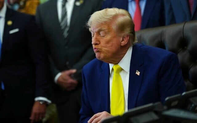 US President Donald Trump listens at an event about coal, on June 4, 2026, in the Oval Office of the White House in Washington. (AP Photo/Julia Demaree Nikhinson)