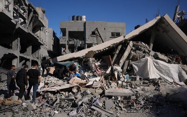 Illustrative: Palestinians inspect the rubble of a building destroyed in an Israeli strike in Zawaida, in the central Gaza Strip, Friday, June 5, 2026. (AP Photo/Abdel Kareem Hana) Illustrative: Palestinians inspect the rubble of a building destroyed in an Israeli strike in Zawaida, in the central Gaza Strip, Friday, June 5, 2026. (AP Photo/Abdel Kareem Hana)