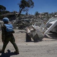 Spanish UN peacekeepers clear a road after clashes between Hezbollah fighters and Israeli troops in Dibbine village, southeast Lebanon, June 5, 2026, a day after Israeli forces withdrew. (AP Photo/Hussein Malla)