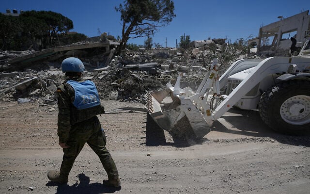 Spanish UN peacekeepers clear a road after clashes between Hezbollah fighters and Israeli troops in Dibbine village, southeast Lebanon, June 5, 2026, a day after Israeli forces withdrew. (AP Photo/Hussein Malla)