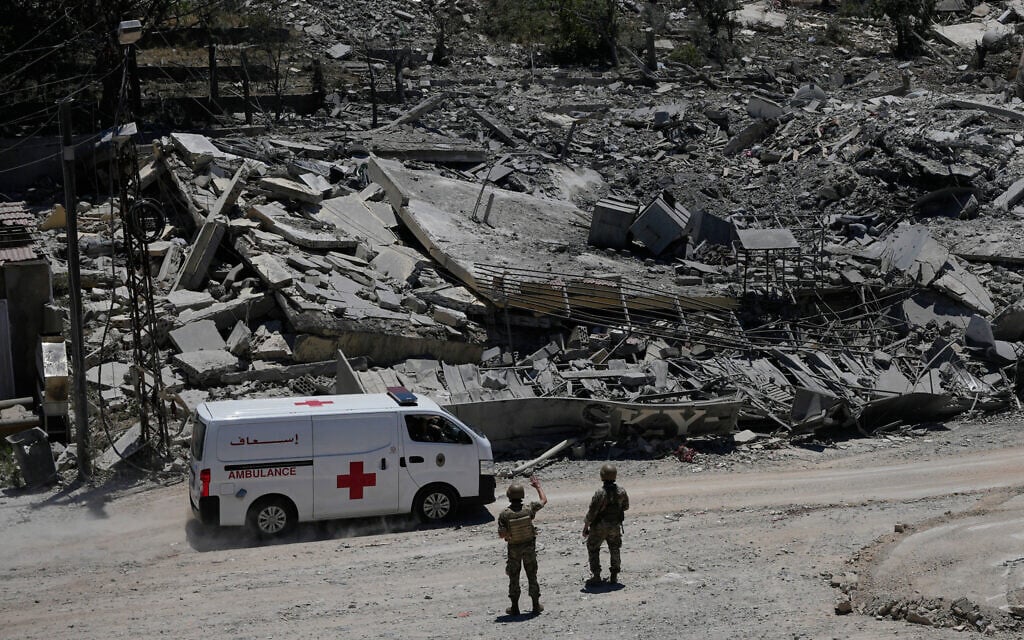 Lebanese soldiers deploy at a road in front of destroyed houses in the village of Dibbine, southeast Lebanon, on June 5, 2026, a day after Israeli forces withdrew. (AP Photo/Hussein Malla)