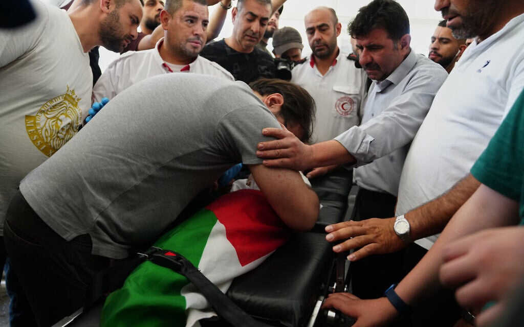 Fahd Abou Haikal, 41, mourns over the body of his seven-month-old Sam, who was killed by Israeli soldiers in the West Bank city of Hebron, June 6, 2026. The IDF expressed 'deep sorrow' over the incident. (AP Photo/Mahmoud Illean)