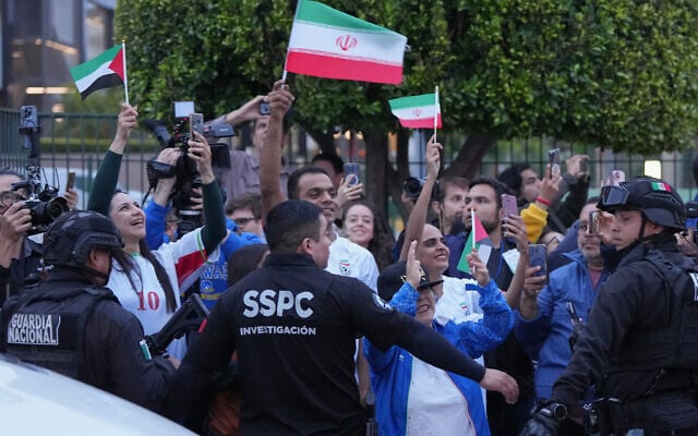 Fans for team Iran wave as players arrive for the World Cup soccer tournament in Tijuana, Mexico, June 7, 2026. (AP Photo/Gregory Bull) Fans for team Iran wave as players arrive for the World Cup soccer tournament in Tijuana, Mexico, June 7, 2026. (AP Photo/Gregory Bull)