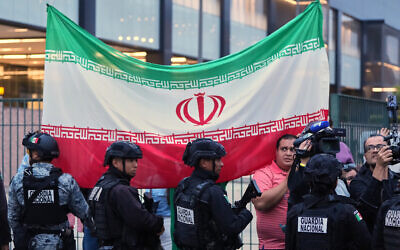 Fans for team Iran wave as players arrive for the World Cup soccer tournament in Tijuana, Mexico, June 7, 2026. (Gregory Bull/AP)