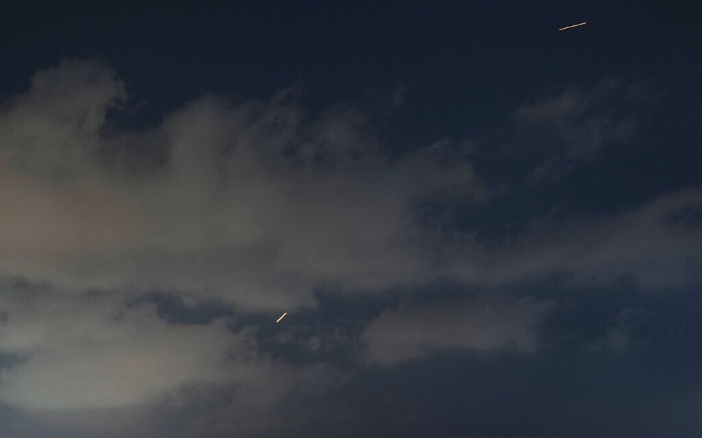 An Israeli air defense system fires to intercept missiles that were launched from Iran, as seen from Hadera, northern Israel, Sunday, June 7, 2026. (AP Photo/Ariel Schalit)