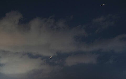 An Israeli air defense system fires to intercept missiles that were launched from Iran, as seen from Hadera, northern Israel, Sunday, June 7, 2026. (AP Photo/Ariel Schalit)