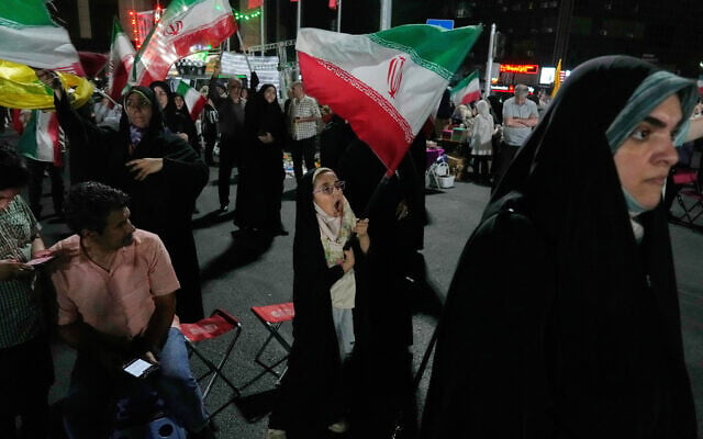 A girl waves an Iranian flag in a pro-government gathering in Tehran, Iran, June 7, 2026. (AP Photo/Vahid Salemi) A girl waves an Iranian flag in a pro-government gathering in Tehran, Iran, June 7, 2026. (AP Photo/Vahid Salemi)