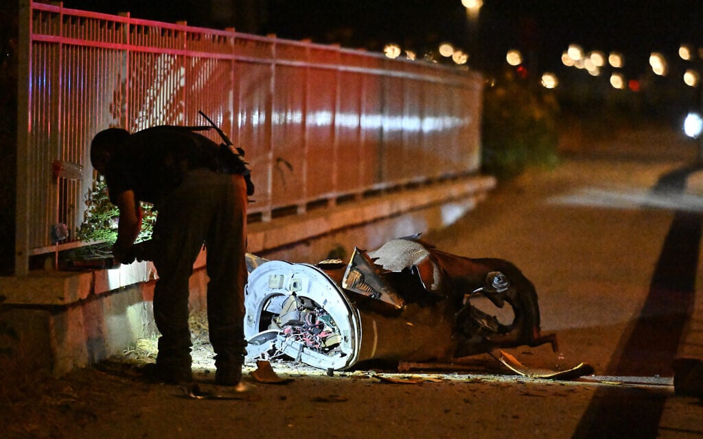 Israeli security forces examine a fragment of an intercepted Iranian missile in northern Israel, June 8, 2026. (AP/Rami Shlush)