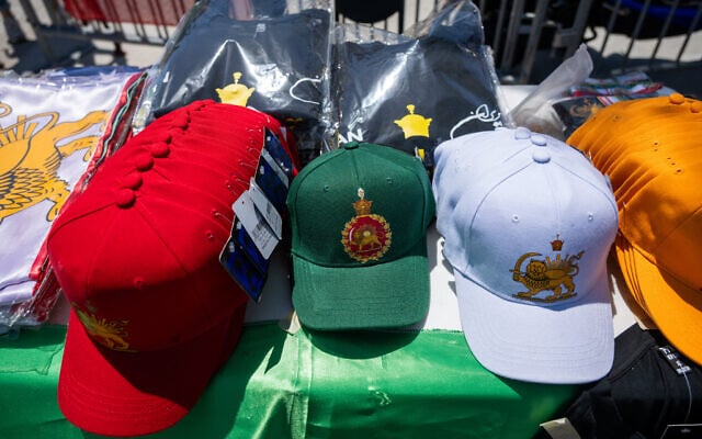 Merchandise sits for sale during a protest in reaction to FIFA's ban of Iran's pre-revolutionary flag inside World Cup stadiums, June 7, 2026, in Inglewood, California. (AP/Benjamin Hanson)