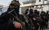 FILE - Palestinian gunmen from Hamas and Islamic Jihad gather next to Eid al-Fitr prayers in Gaza City, March 20, 2026. (AP Photo/Abdel Kareem Hana, File)