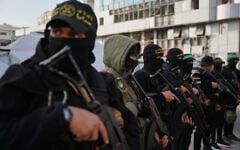 Palestinian gunmen from Hamas and Islamic Jihad gather next to Eid al-Fitr prayers in Gaza City, March 20, 2026. (AP Photo/Abdel Kareem Hana)
