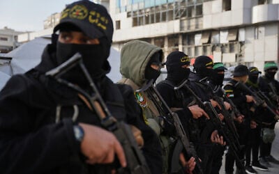 FILE - Palestinian gunmen from Hamas and Islamic Jihad gather next to Eid al-Fitr prayers in Gaza City, March 20, 2026. (AP Photo/Abdel Kareem Hana, File)