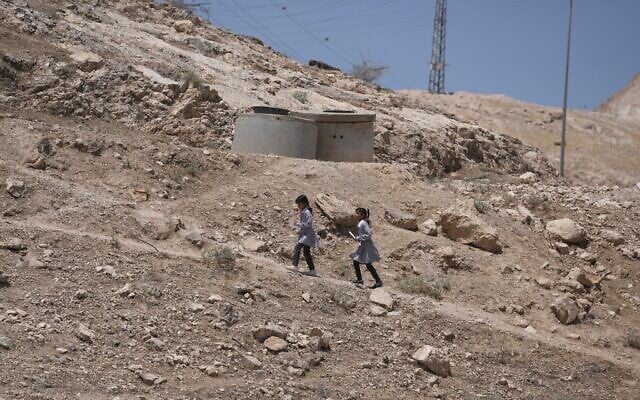 Palestinian students walk on their way home after receiving their year end reports from school, in the West Bank Bedouin hamlets of Khan al-Ahmar, June 10, 2026. (AP Photo/Mahmoud Illean) Palestinian students walk on their way home after receiving their year end reports from school, in the West Bank Bedouin hamlets of Khan al-Ahmar, June 10, 2026. (AP Photo/Mahmoud Illean)