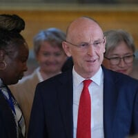 UK Defence Secretary John Healey walks into the press conference following the AUKMIN Summit, at Lancaster House in London,  June 10, 2026. (Kin Cheung/AP)