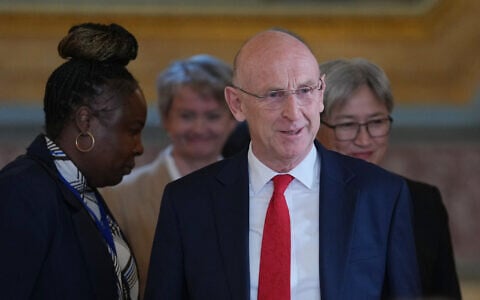 UK Defence Secretary John Healey walks into the press conference following the AUKMIN Summit, at Lancaster House in London,  June 10, 2026. (Kin Cheung/AP)