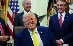 US President Donald Trump laughs during an event in the Oval Office of the White House, in Washington, June 4, 2026. (Julia Demaree Nikhinson/AP)