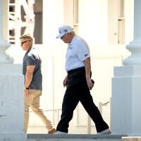 US President Donald Trump walks to his limousine at the North Portico of the White House, June 13, 2026, in Washington. (AP Photo/Mark Schiefelbein)