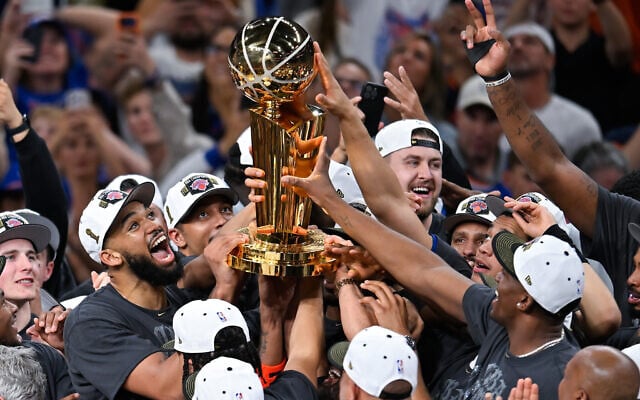The New York Knicks celebrate with the Larry O'Brien Championship Trophy after defeating the San Antonio Spurs in Game 5 of the NBA Finals basketball series, June 13, 2026, in San Antonio. (AP Photo/Darren Abate) The New York Knicks celebrate with the Larry O'Brien Championship Trophy after defeating the San Antonio Spurs in Game 5 of the NBA Finals basketball series, June 13, 2026, in San Antonio. (AP Photo/Darren Abate)