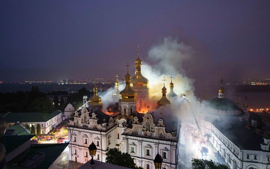 Rescue workers try to put out a fire at the Dormition Cathedral of thousand-year-old Monastery of Caves, also known as Kyiv-Pechersk Lavra, following a Russian strike on Kyiv, Ukraine, June 15, 2026. (AP Photo/Evgeniy Maloletka)