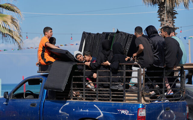 A displaced family with their belongings ride on a pickup truck as they return to their village following the announcement of an initial ceasefire agreement between the United States and Iran, in the southern port city of Sidon, Lebanon, June 15, 2026. (AP Photo/Mohammed Zaatari)