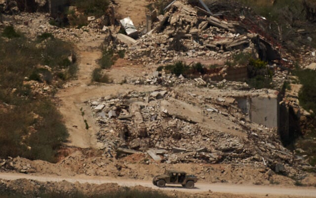 A Israeli military vehicle moves past destroyed buildings in southern Lebanon as seen from northern Israel, June 15, 2026. (AP/Leo Correa) A Israeli military vehicle moves past destroyed buildings in southern Lebanon as seen from northern Israel, June 15, 2026. (AP/Leo Correa)